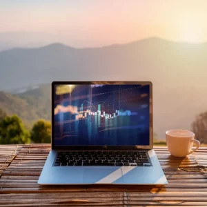 Computer laptop overlooking mountain