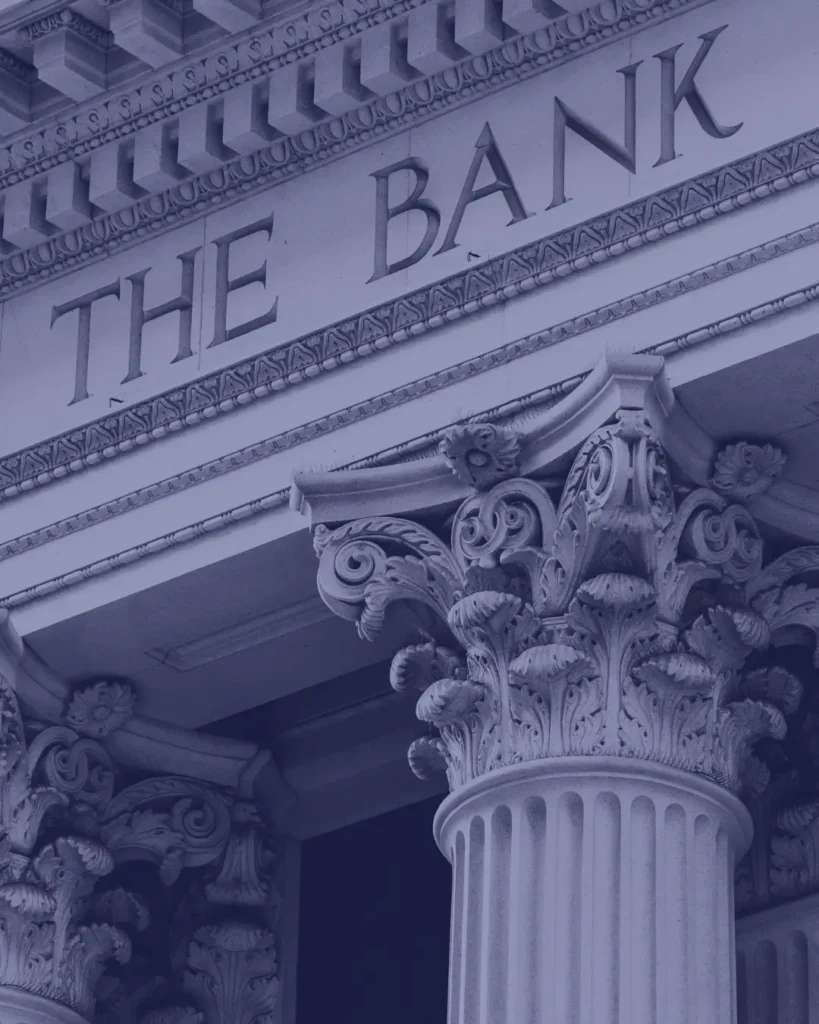 Stone bank building exterior — why US banks reject virtual office addresses and registered agent addresses for business account applications.