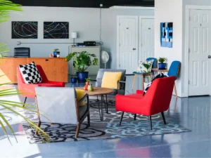 MicroOffice Solutions Casper Wyoming front lobby with reception desk, red and blue seating, plants, abstract artwork and private micro-office suite doors